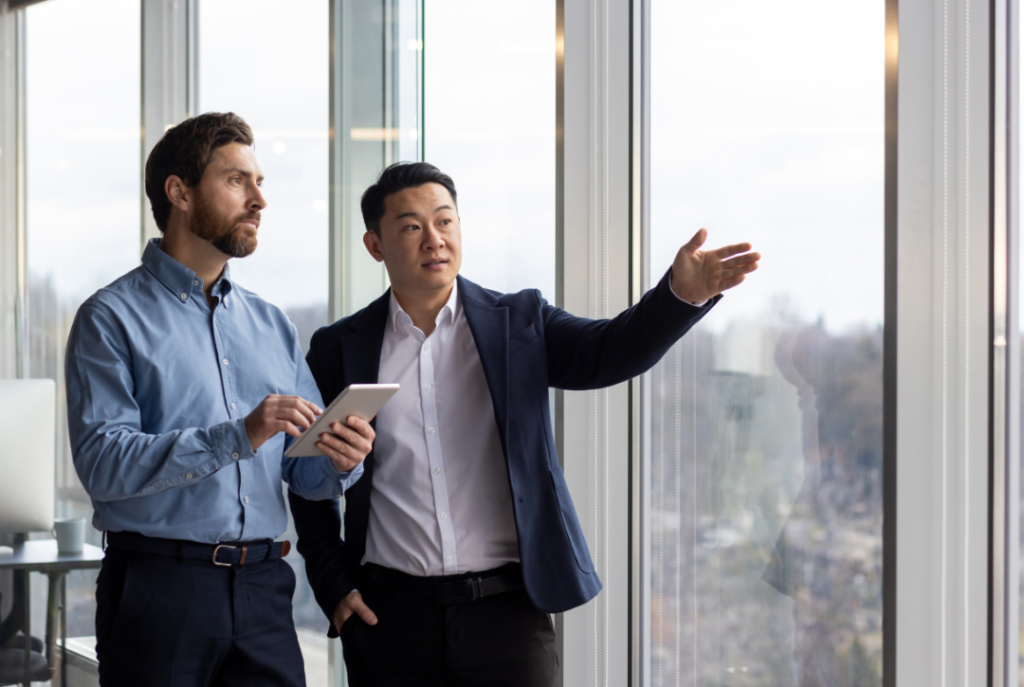 A businessman explaining to a potential investor the great things eb5 projects have achieved