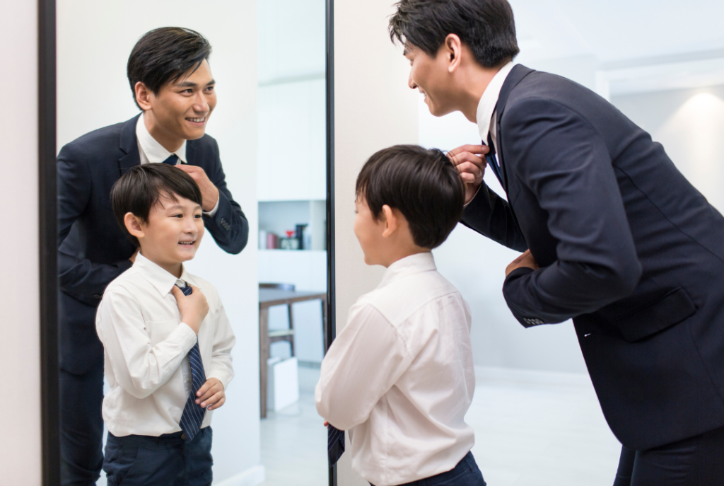 An investor with his son smiling about the future and thinking about the EB-5 funds