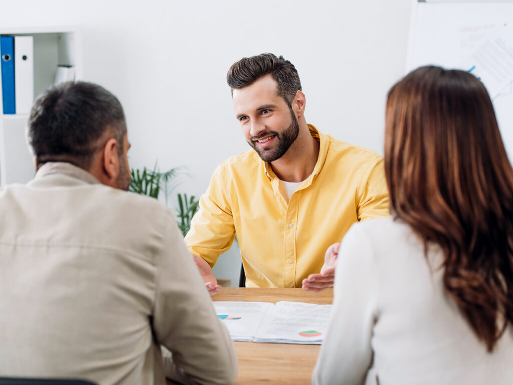 an investor and his wife discussing eb-5 redeployment with their investment team