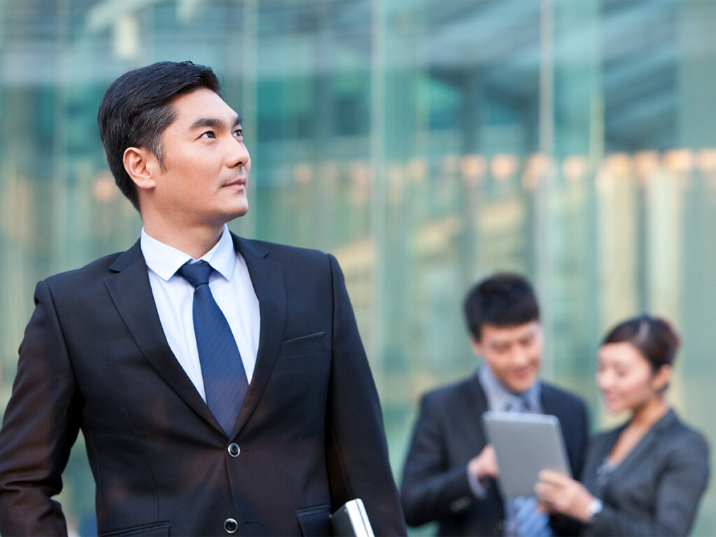 asian investor contemplates what an eb5 eligible business is