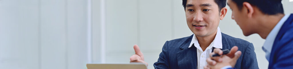 a man consults with his attorney about managing the EB5 waiting time