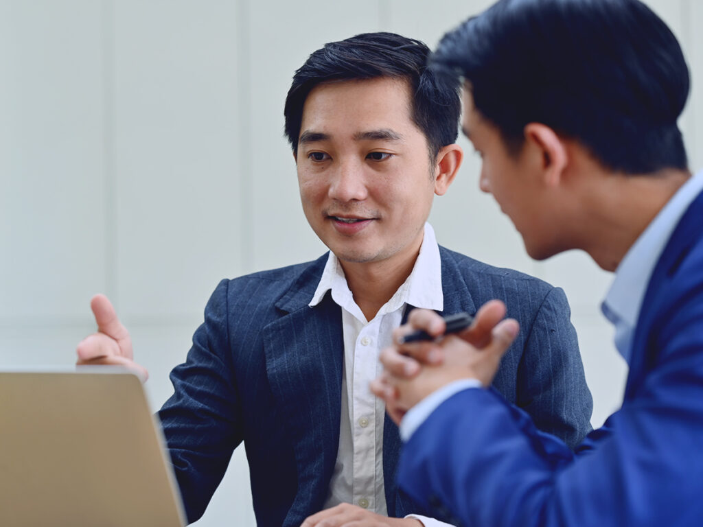 a man consults with his attorney about managing the EB5 waiting time for his investment visa