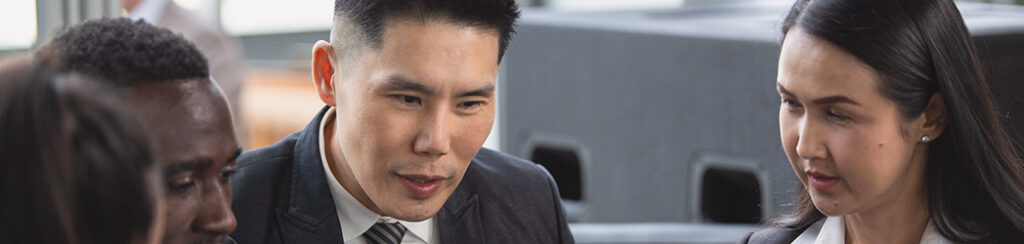 Interested Asian investor discussing eb5 limit in a meeting