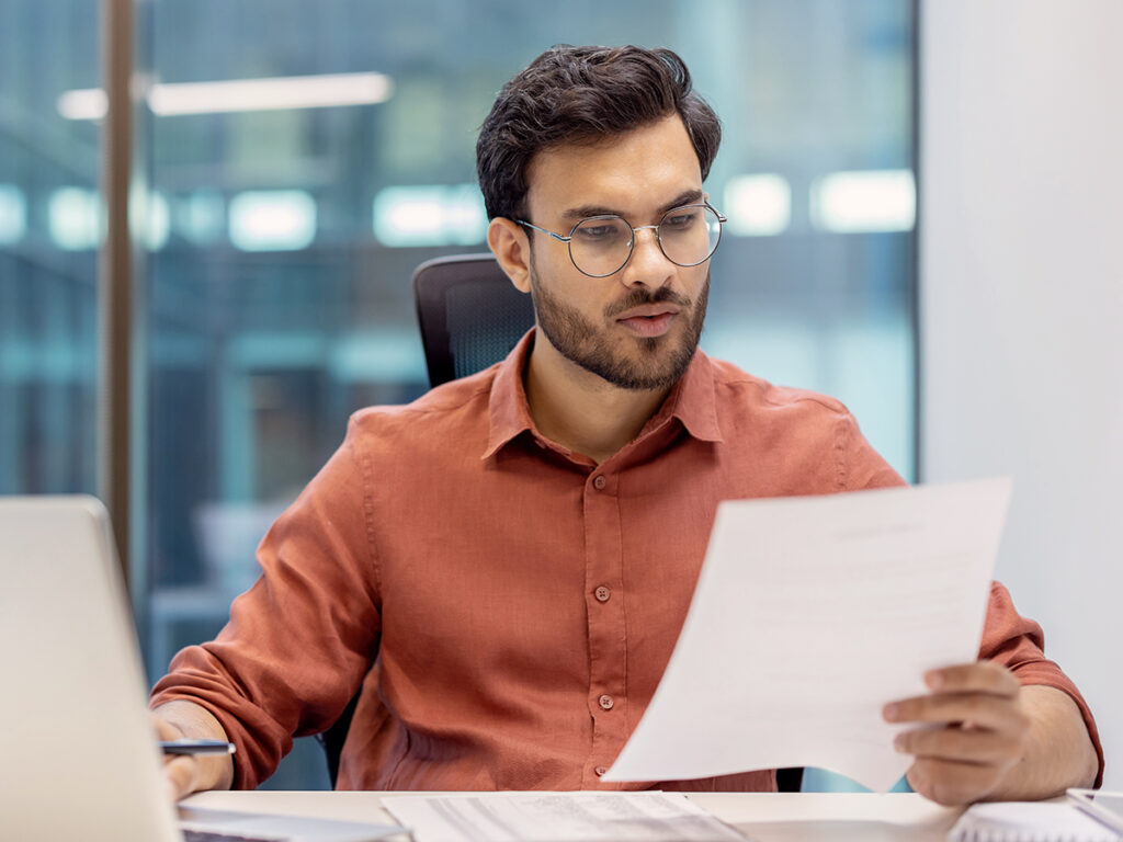 A male foreign investor reviewing an eb5 business plan